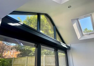 Powder coated anthracite aluminium window and roof glazing detail in Romsey home extension.