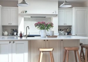 White kitchen units and breakfast bar in Bournemouth ground floor extension.