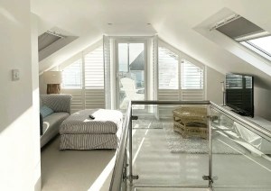 Interior view from glazed balcony with coastal sea views at Southbourne Coast property.
